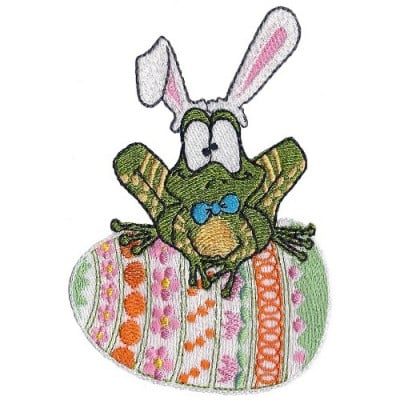 An embroidery design of a whimsical frog with bunny ears sitting atop a colorful Easter egg decorated with various patterns.