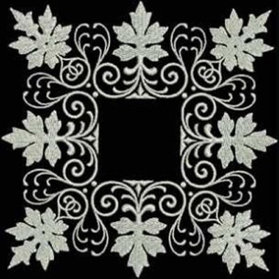 An embroidery design of intertwined leaves and swirling patterns forming a decorative border.