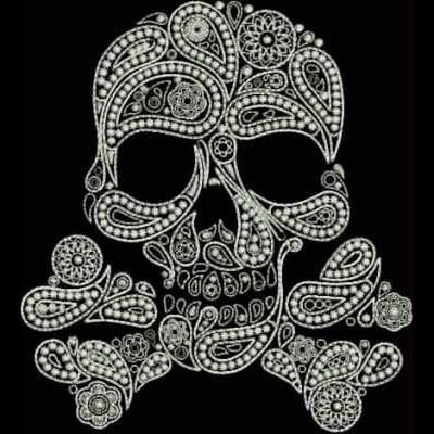 An embroidery design of an ornately decorated skull featuring intricate patterns and floral motifs.
