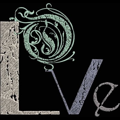 An embroidery design of the word "Love" featuring ornate lettering with a decorative swirl above the letter "o".