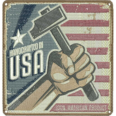 An embroidery design of a raised fist holding a hammer, accompanied by the text "Handcrafted in USA."