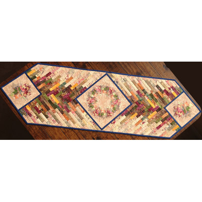 An embroidery design of a geometric table runner featuring a patchwork of colorful fabric strips and floral motifs.
