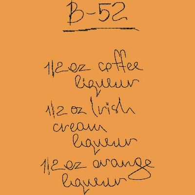An embroidery design of the recipe for a B-52 cocktail, featuring handwritten text that lists coffee liqueur, Irish cream liqueur, and orange liqueur in half-ounce measurements.