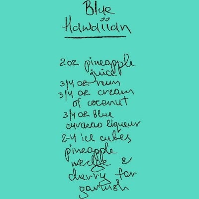 An embroidery design of a recipe for a Blue Hawaiian cocktail, featuring handwritten ingredients and instructions.