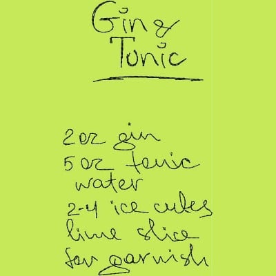 An embroidery design of a handwritten recipe for a gin and tonic, including measurements for gin, tonic, water, ice cubes, and lime garnish.