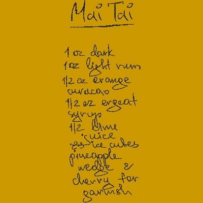 An embroidery design of a handwritten recipe for a Mai Tai cocktail, featuring ingredients and measurements listed in a casual script style.