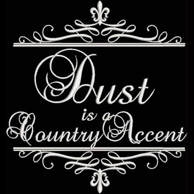 An embroidery design of the phrase "Dust is a Country Accent" framed with decorative flourishes.