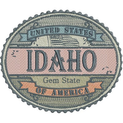 An embroidery design of a decorative patch featuring the words "IDAHO" prominently, along with "Gem State" and "United States of America" in an oval shape with scalloped edges.