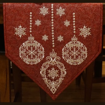 An embroidery design of elegant ornaments and snowflakes, featuring intricate patterns and a festive color palette, perfect for holiday décor.