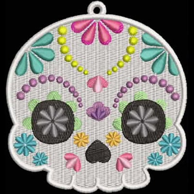 An embroidery design of a decorative skull adorned with colorful floral elements and intricate patterns.