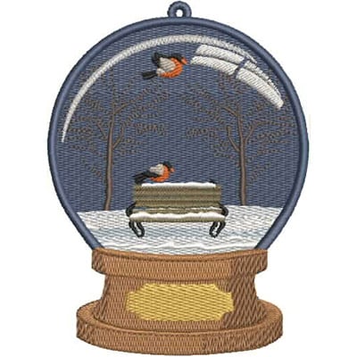 An embroidery design of a snow globe featuring a park bench and birds amidst a snowy scene.