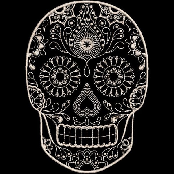 An embroidery design of a decorative skull featuring intricate floral and paisley patterns.