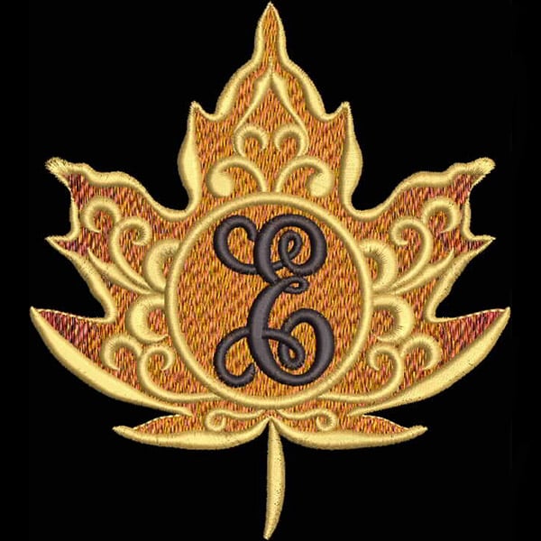 An embroidery design of an ornate golden maple leaf featuring an elegant initial in the center.