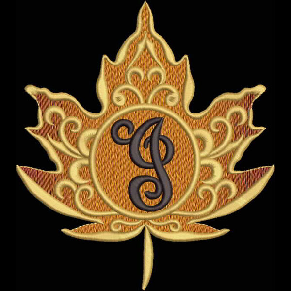 An embroidery design of an ornate maple leaf featuring a central circular element adorned with an elegant letter "J".