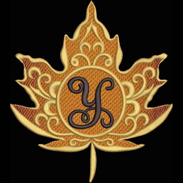 An embroidery design of a decorative maple leaf featuring an ornate circular frame with the letter 'Y' in stylized script at its center.