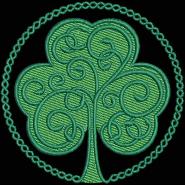 An embroidery design of a stylized, swirling green tree within a decorative circular border.