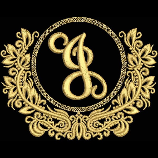 An embroidery design of an elegant, stylized letter "J" surrounded by intricate floral and scroll motifs in golden thread.