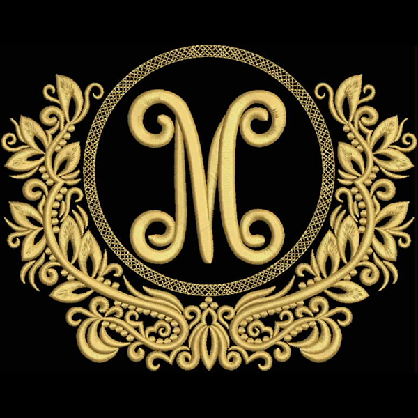 An embroidery design of a stylized letter "M" surrounded by intricate floral motifs and a circular border.