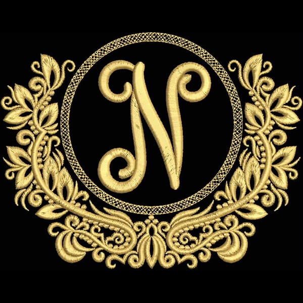 An embroidery design of an ornate circular frame featuring a stylized letter "N" at its center, embellished with delicate floral motifs.
