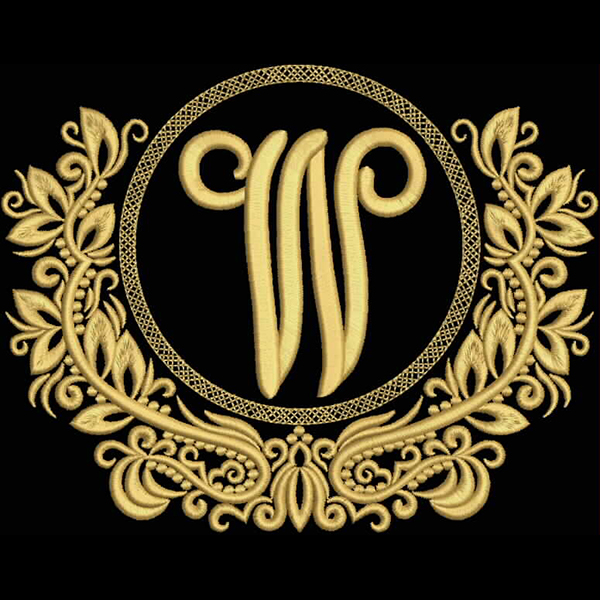 An embroidery design of an ornate golden letter 'W' surrounded by decorative floral elements.