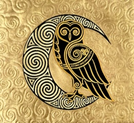 An embroidery design of a stylized owl perched on a swirling crescent moon, featuring intricate patterns in black and gold.