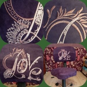 An embroidery design of the word "Love" surrounded by elegant swirling patterns and floral motifs in a soft metallic thread.