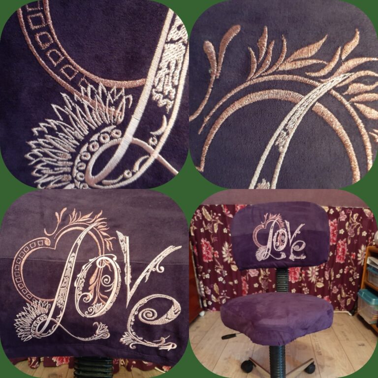 An embroidery design of the word "Love" surrounded by elegant swirling patterns and floral motifs in a soft metallic thread.